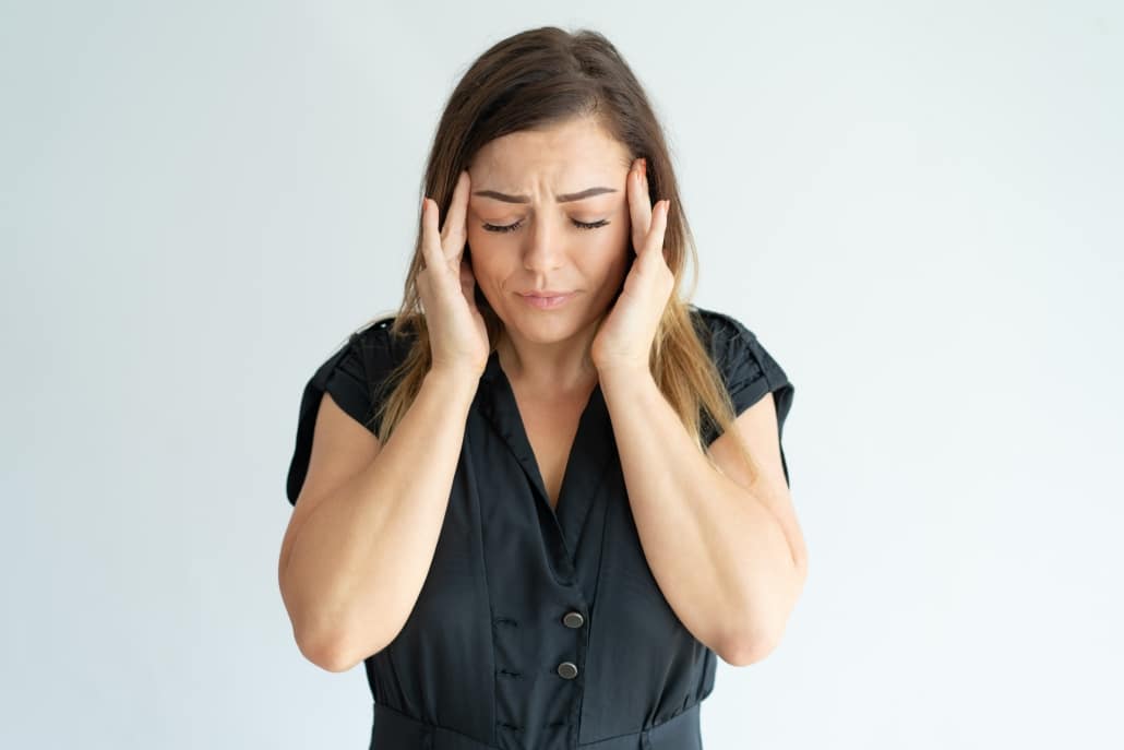woman suffering from ocular migraines